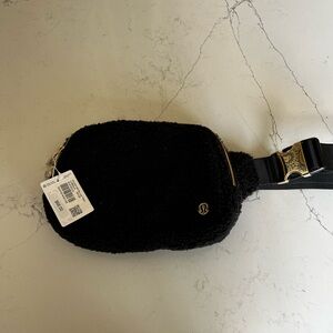 NEW with tags- black Sherpa lululemon fannypack with gold zippers!
